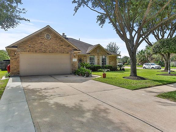 2 car garage with wide driveway.