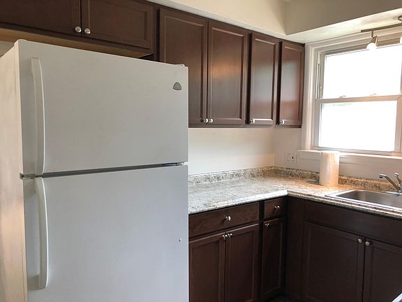 Kitchen with full size refrigerator