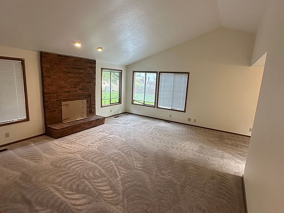 Living room with wood fire pit.