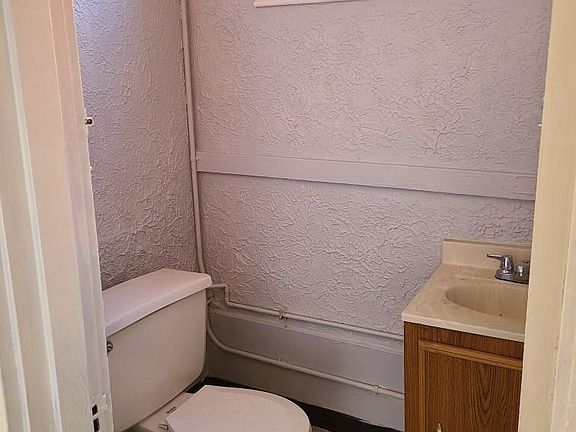 1/2 bath/powder room off of kitchen.