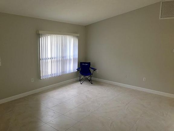 Bright, spacious living and dirning room with vaulted ceilings.