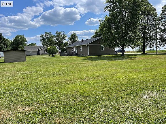 View of home and double lot.