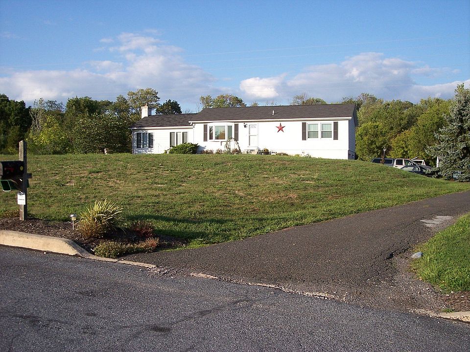 Front View With Driveway
