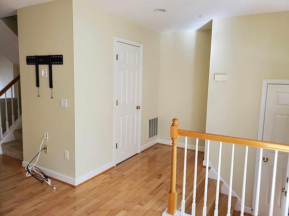 half bath to the left, coat closet down the stairs by front door