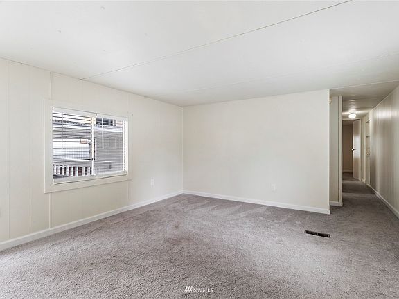 Living room with new custom blinds and paint