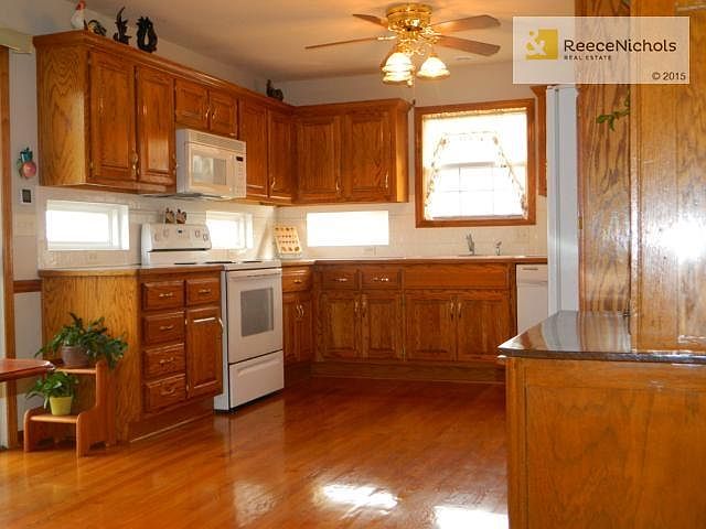 You'll love entertaining with this kitchen! The small windows un
