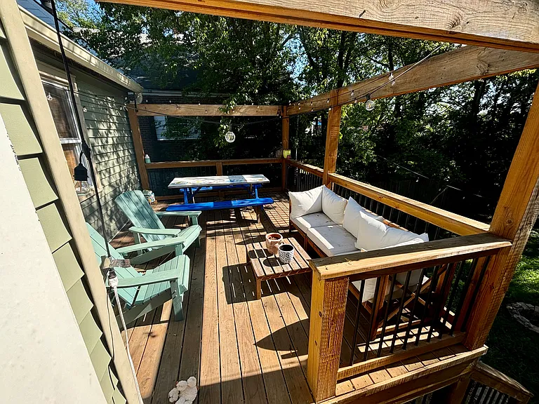 Backporch! Lights hanging from deck to yard at night.
Willing to leave picnic table & chairs.