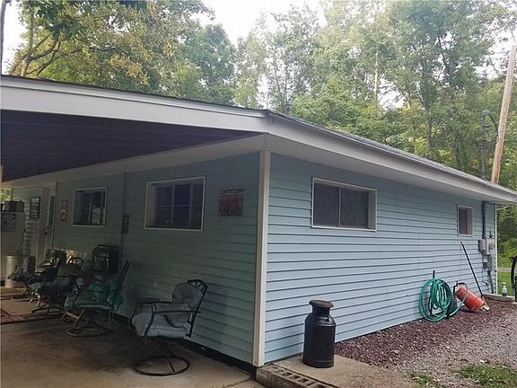 ANGLE OF SIDE AND PART OF REAR PORCH
