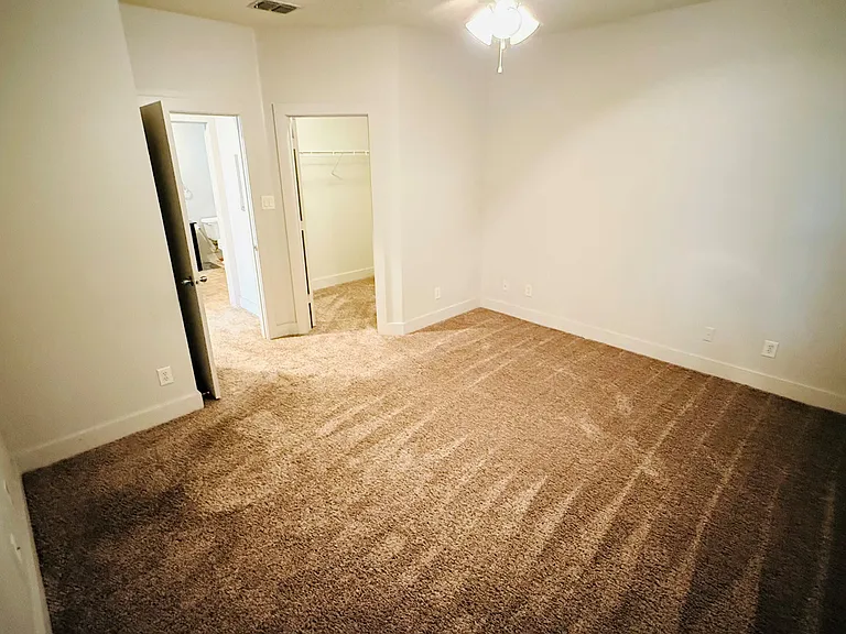 Spacious Bedroom with walk in closet and modern bathroom