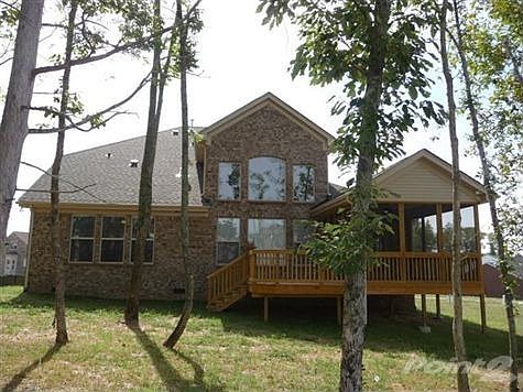 PREMIUM TREED LOT WITH IRRIGATION, LANDSCAPE LIGHTING, INSULATED CARRIAGE GARAGE DOORS & WALLS PLUS 