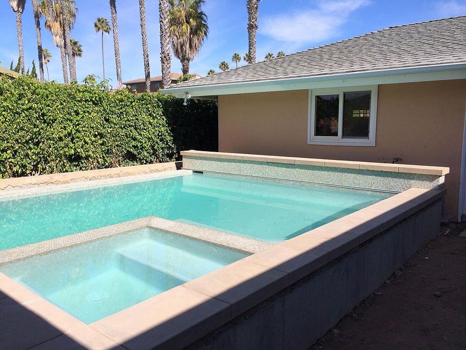 Heated pool and jacuzzi with cover
