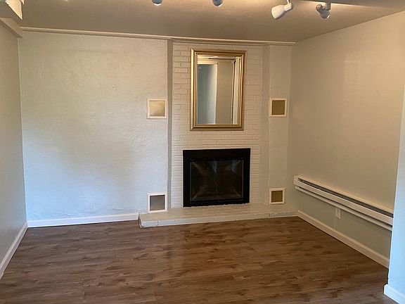 The living room with the fireplace.