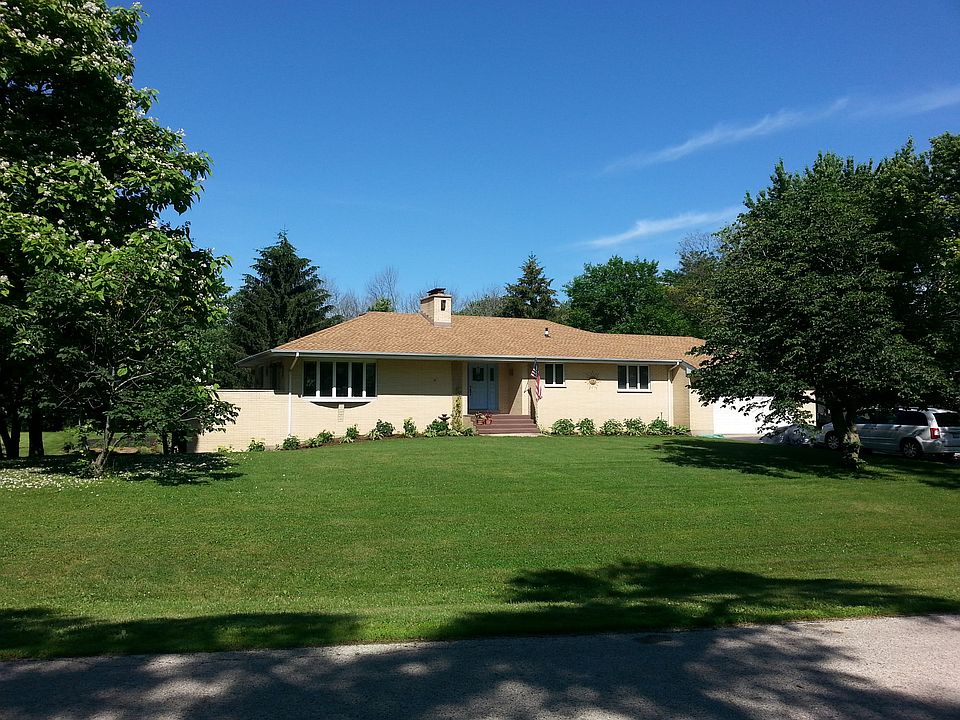 Exterior of home with walk out apartment at far left