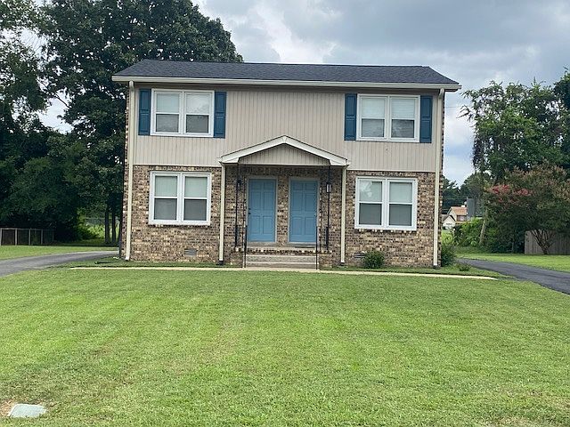 1802 is the right side of the house. The roof, gutters, and shutters are new. Easy open windows for air flow and cleaning. Back door entrance opens into the kitchen. Front door entrance is into the den. Large yard.