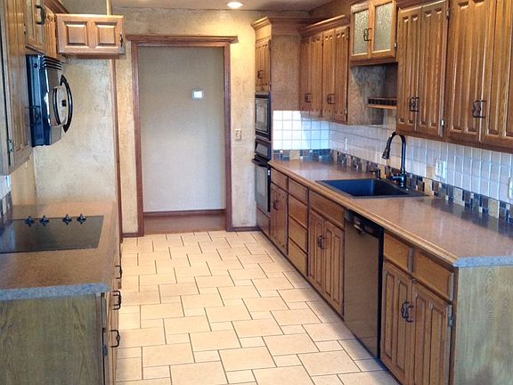 Kitchen with nice updates, wonderful cabinetry and comfortable lighting!