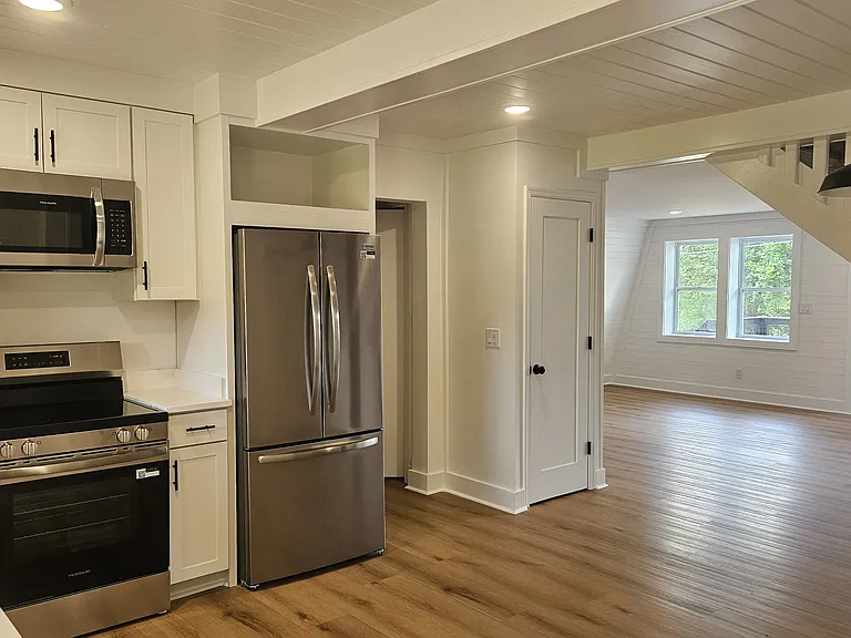 Kitchen looking into living room