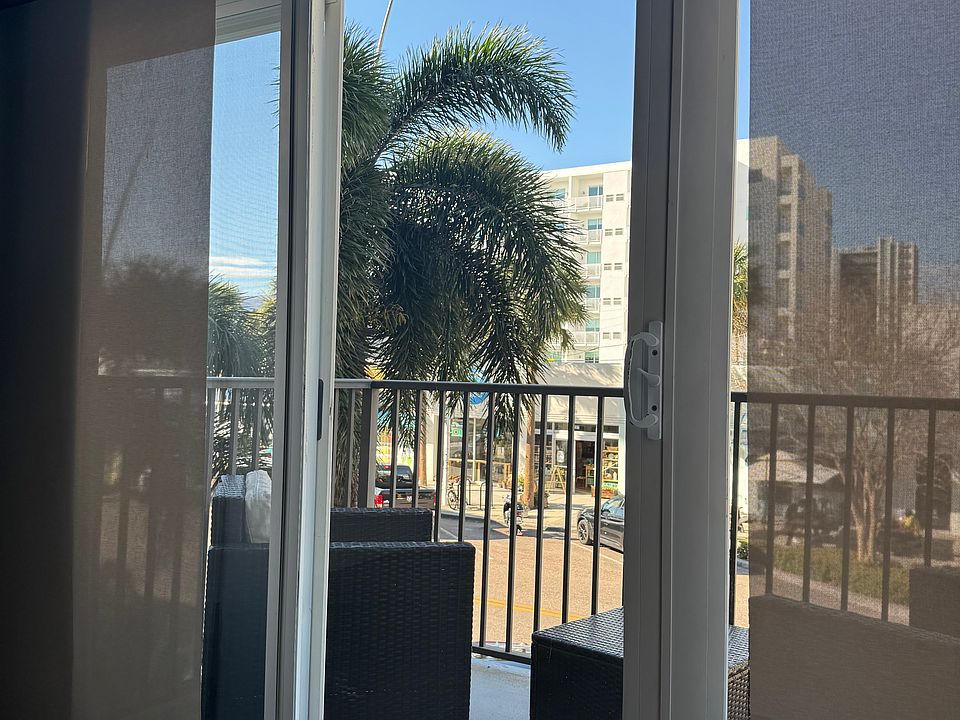 Spacious living room with a private balcony overlooking Central Avenue, nestled in the heart of the Edge District.