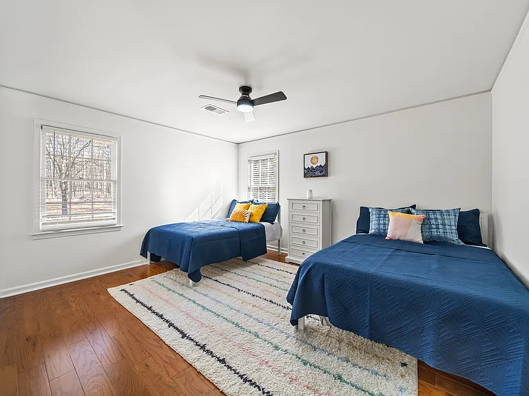Two Full Beds:

Unwind in the third bedroom, thoughtfully designed with two full-size beds, bedside table with lamp, Smart Roku TV, a luggage rack, and plenty of storage_ideal for families or groups traveling together.