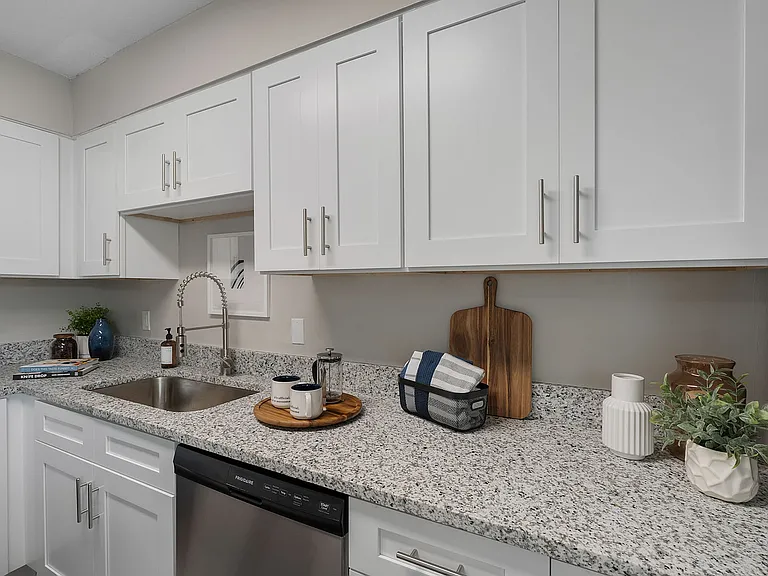 Kitchen with granite counters, stainless appliances, and modern cabinetry