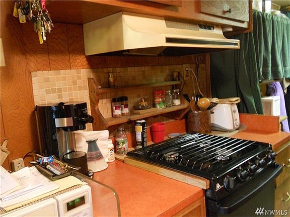 More prep area, 3 burner propane stove and oven.