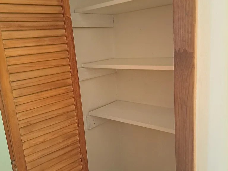Linen closet in bathroom.