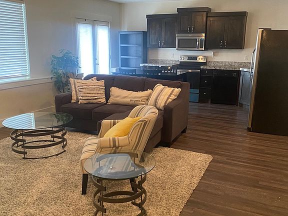 Open floor plan of living room, dining room, and kitchen