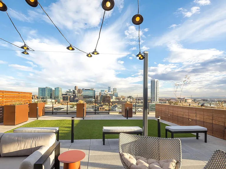 Rooftop Deck Lounge Area with Panoramic Views of the City.
