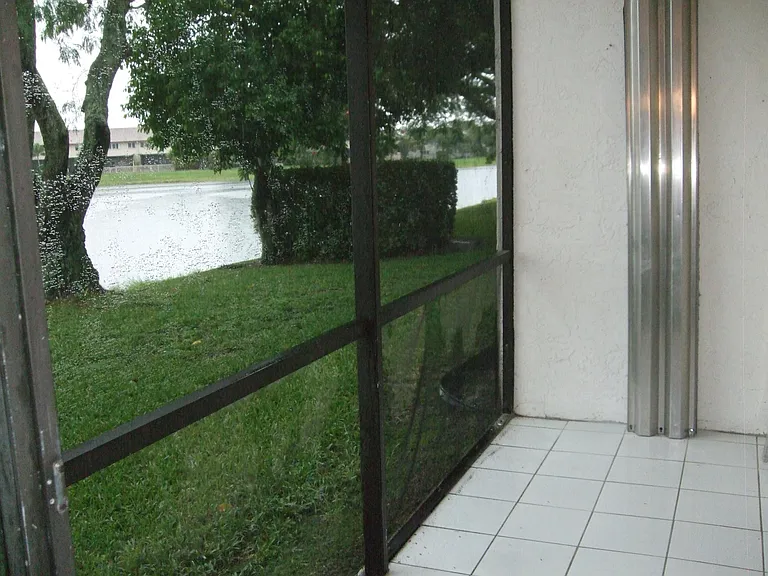 Screened in porch with ceramic tile floors and hurricane shutters
Great place to BBQ