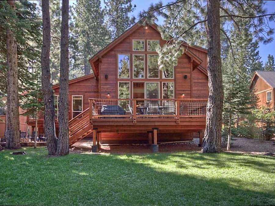 "Landscaped backyard with 1200 square foot lawn and horse shoe pit"