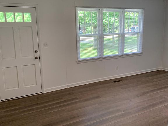 View of living room from kitchen hallway