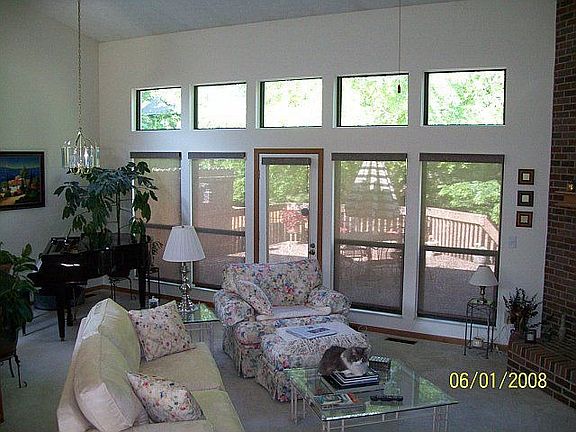great room looking onto deck; solar shade down