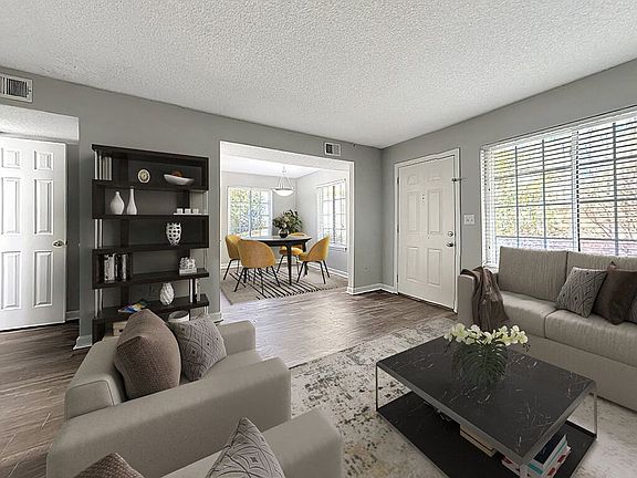Spacious Living Area With Wood Style Flooring