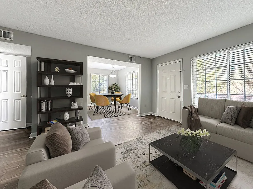 Spacious Living Area With Hardwood-Style Flooring