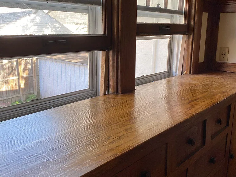 Built in oak buffet/ storage on west wall of dining area