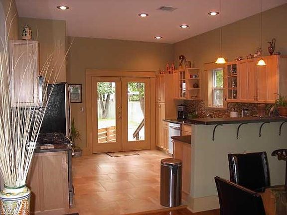 Kitchen open to living and dining room.