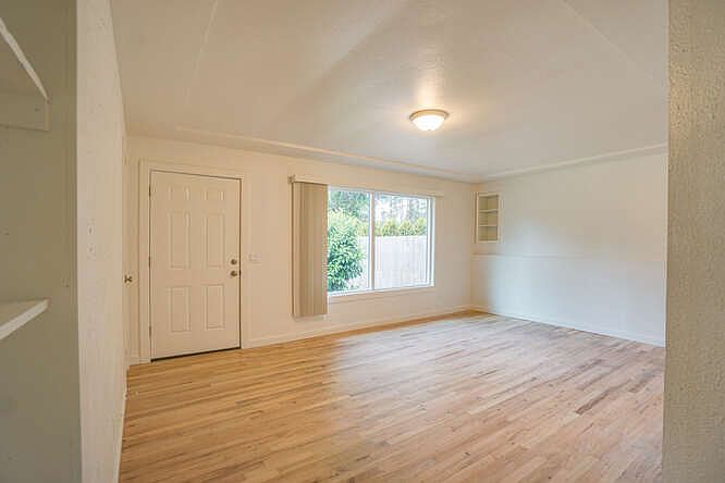 Hardwood floors and built in book cases