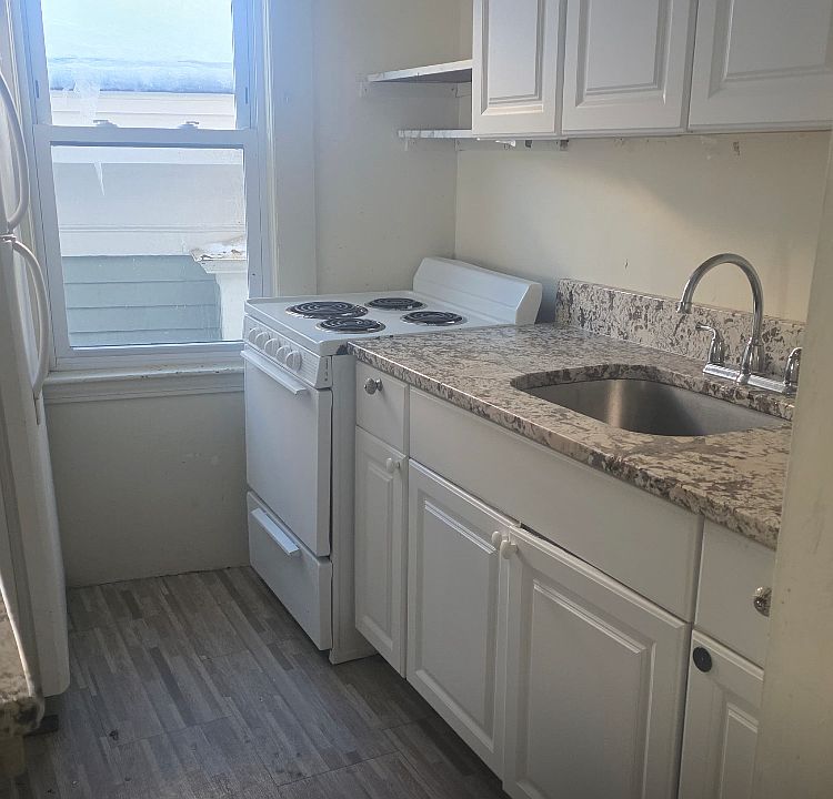 Galley kitchen. Granite counter. Undermount sink