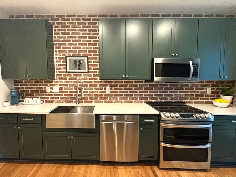 New kitchen with double oven (upper convention) and induction burners. Whisper quiet dishwasher. Original, lenticular art by C. Martino.