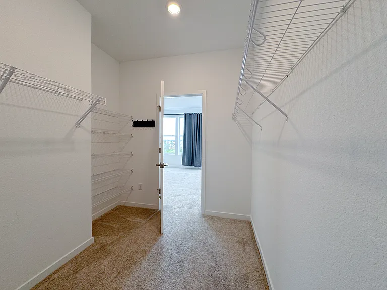 Spacious master closet with plenty of space to keep everything in place