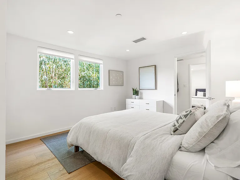 Elegant decor and a comfy bed make this bedroom a perfect retreat.