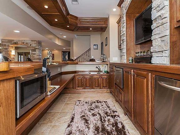 Bar has seating for 10 and a built in dishwasher