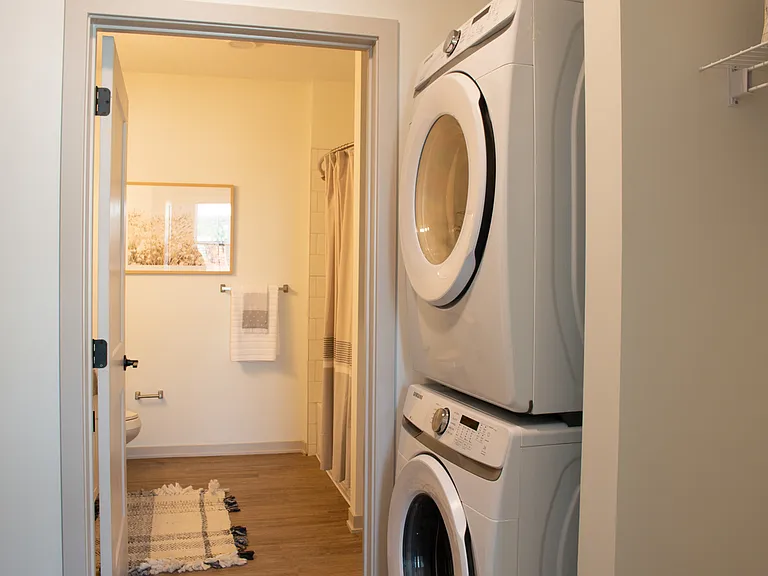 Your Nese apartment features an in-unit washer and dryer integrated into a modern space.