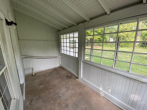 Sunroom and rear entrance to kitchen