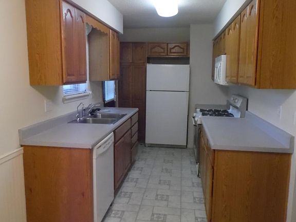 Galley style kitchen with all appliances included