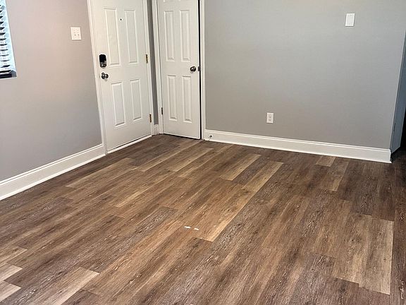 Living room, looking at front door and closet