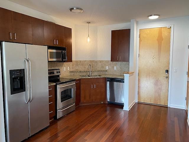 Kitchen with stainless steel appliances and granite counter tops