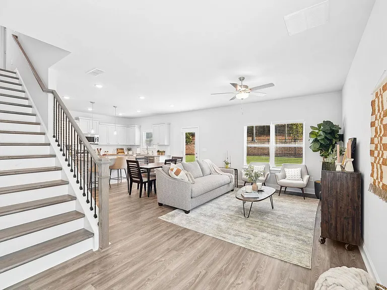 Elegant view of the living room and staircase.