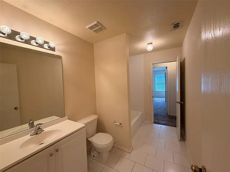 WALK THRU HALL BATH BETWEEN 3 BEDROOMS.