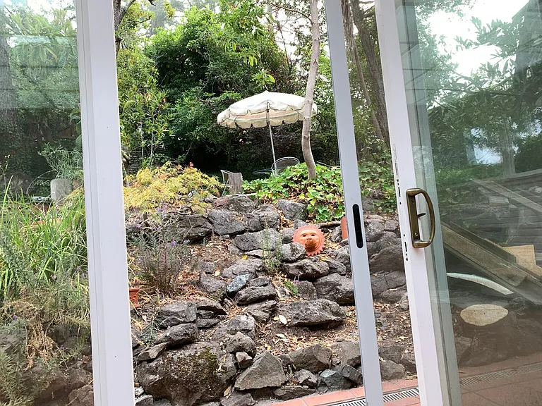 Large French door opening to Rock garden ( zen)