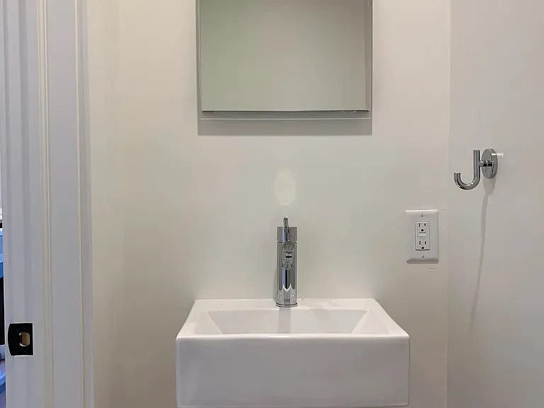 Chic powder room just off the kitchen.